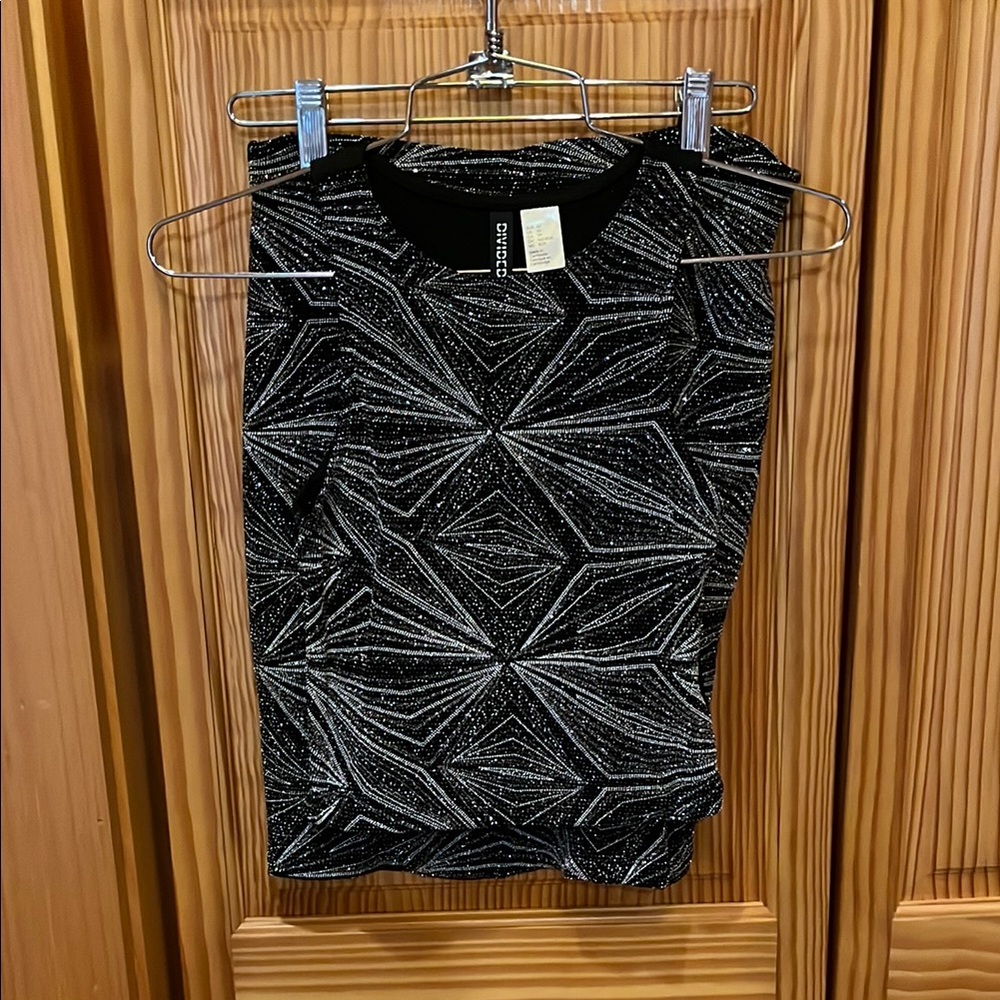 Divided Black Sleeveless Top & Fitted Skirt with Graphic Desigh